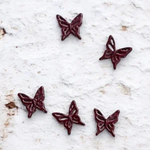 Dije Mariposa bordó x 4u